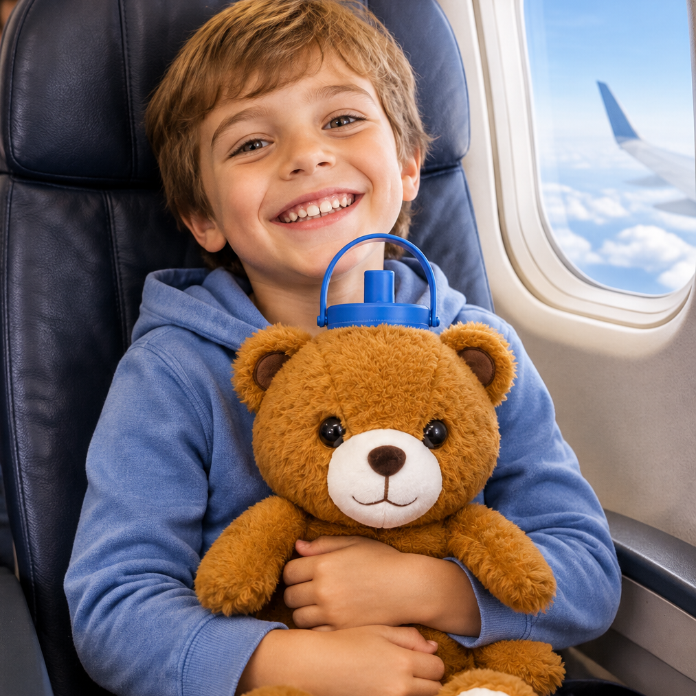 Boy with Ollie Bear on airplane